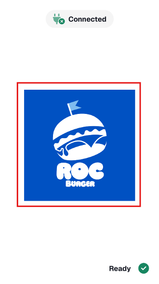 Payroc App idle screen with a custom Roc Burger logo highlighted in the center